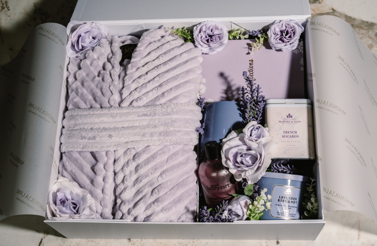 The Grace Collection unboxed — plush robe, candle, tea, mug, journal, and florals