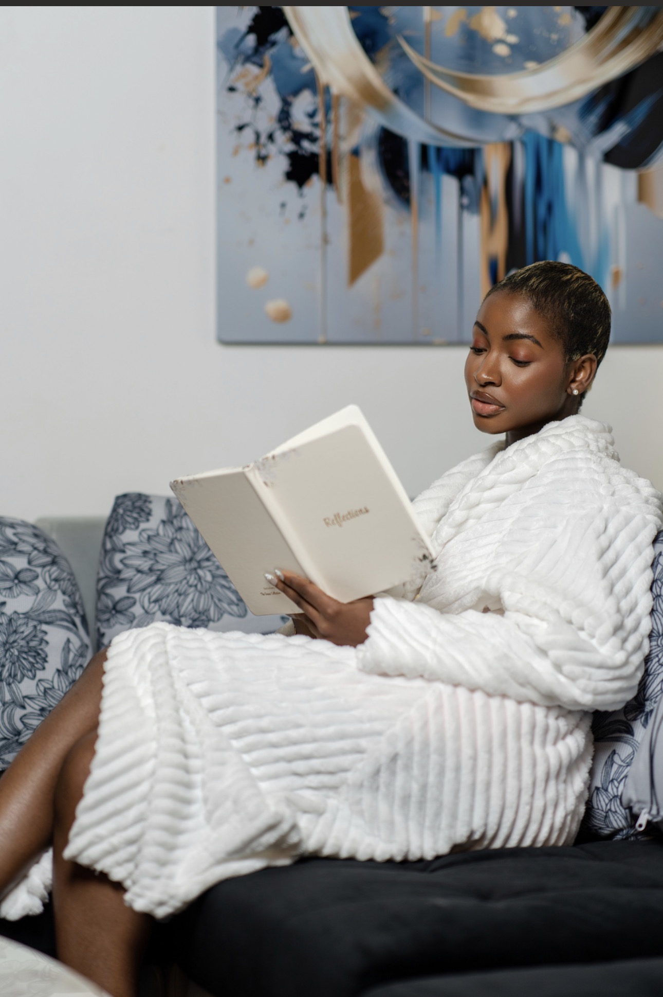 A woman in a cream robe enjoying a quiet morning